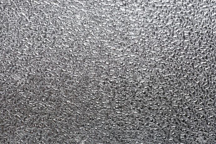 30522847-background-metal-texture-of-a-rough-metal-sheet-with-a-shiny-metallic-surface-reflecting-light-and-s
